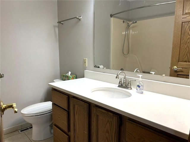 3002 N Charlotte St, Effingham, IL 62401 - bathroom with tile patterned flooring, toilet, vanity, and a shower