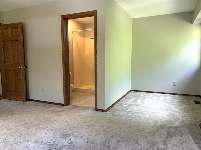 3002 N Charlotte St, Effingham, IL 62401 - unfurnished bedroom featuring carpet floors, baseboards, and ensuite bathroom