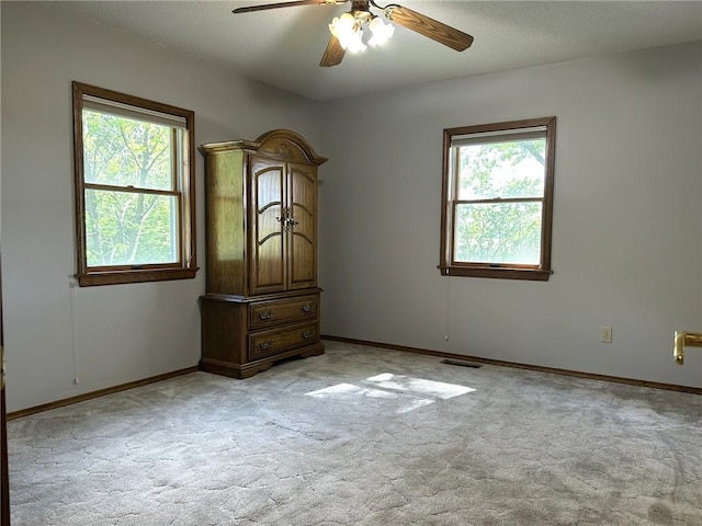 3002 N Charlotte St, Effingham, IL 62401 - unfurnished room with healthy amount of natural light, light colored carpet, and ceiling fan