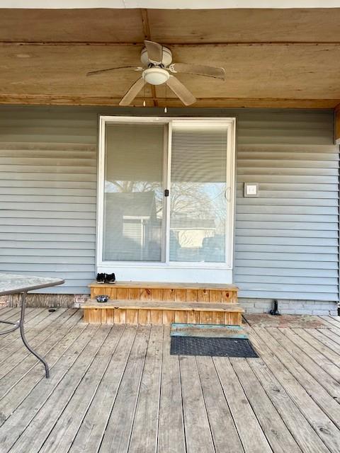 wooden deck with ceiling fan