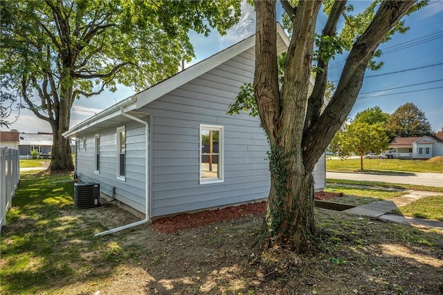 view of side of property with central AC