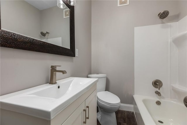 full bathroom with wood-type flooring, shower / tub combination, vanity, and toilet