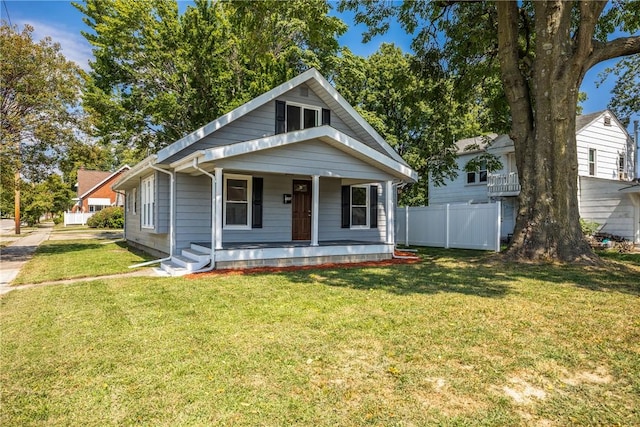 bungalow featuring a front yard and a porch