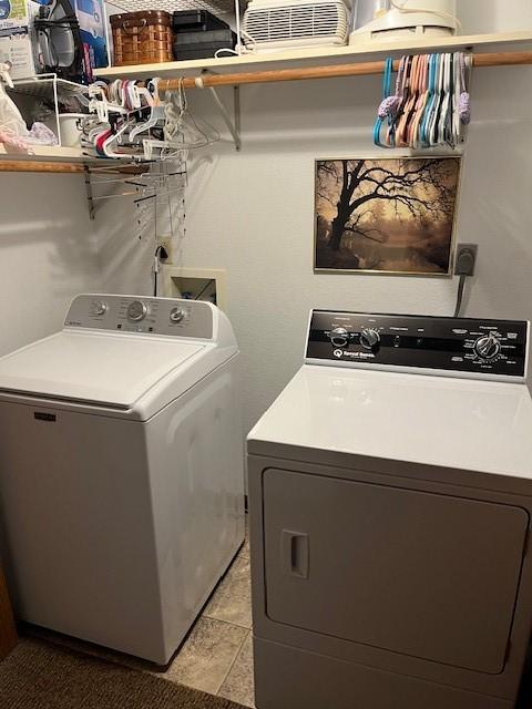washroom with separate washer and dryer