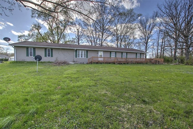 single story home featuring a deck and a front lawn