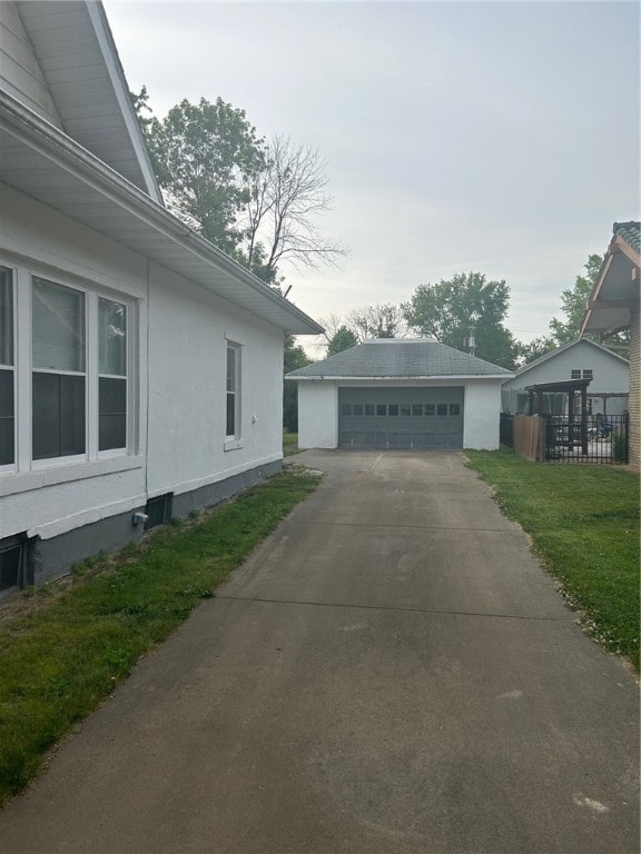 view of home's exterior featuring a garage and an outdoor structure