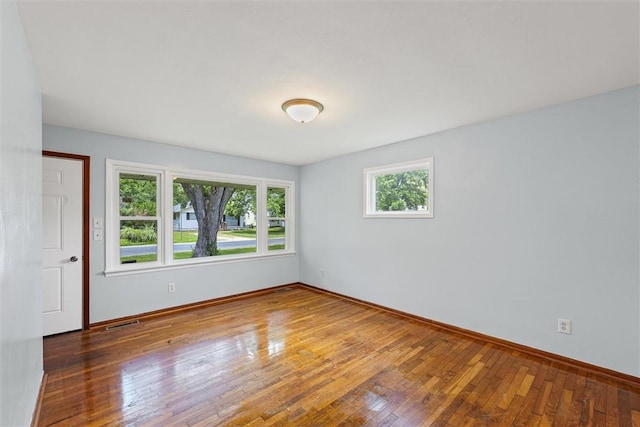 1609 10th St, Charleston, IL 61920 - spare room with hardwood / wood-style floors and baseboards