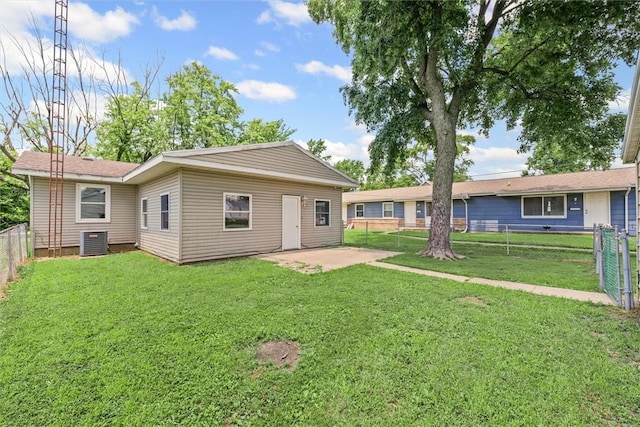 1609 10th St, Charleston, IL 61920 - rear view of property with a fenced backyard and a patio area