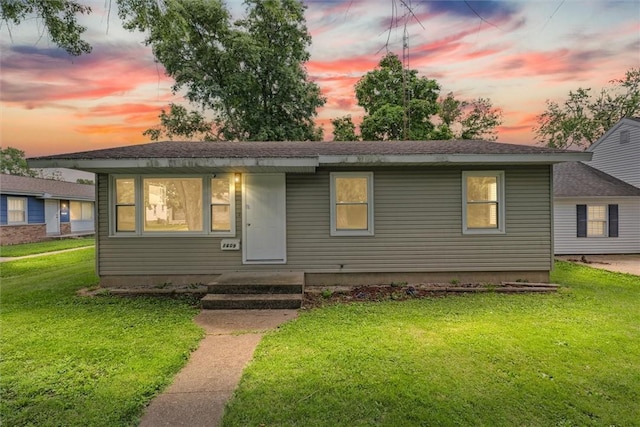 1609 10th St, Charleston, IL 61920 - bungalow-style house with a front lawn and a shingled roof