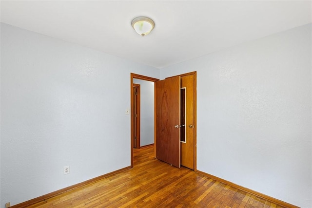 1609 10th St, Charleston, IL 61920 - unfurnished room featuring wood finished floors and baseboards
