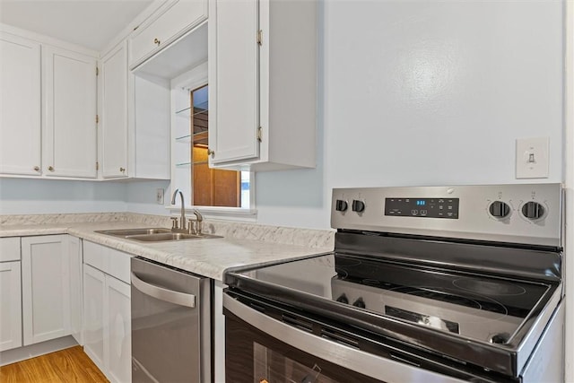 1609 10th St, Charleston, IL 61920 - kitchen featuring appliances with stainless steel finishes and white cabinetry