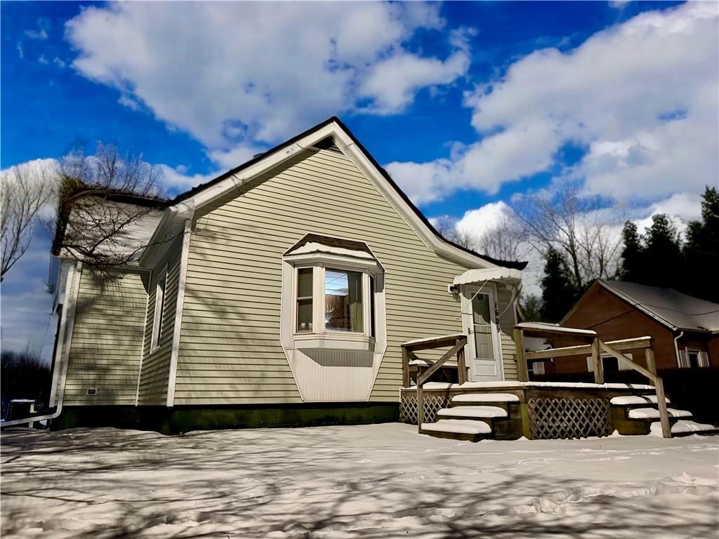 rear view of property with a deck