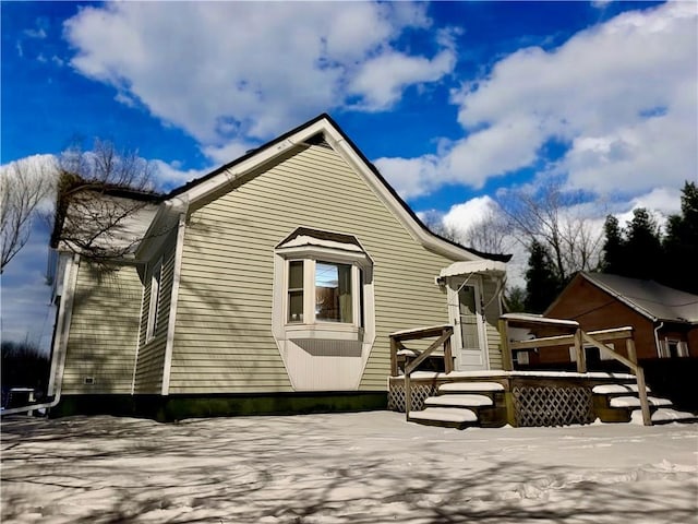 rear view of property with a deck