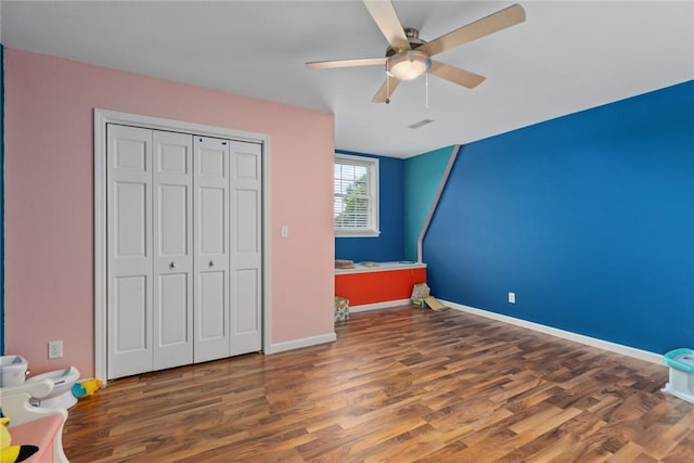 2098 2070th Ave, Saint Elmo, IL 62458 - unfurnished bedroom with wood finished floors, a closet, and a ceiling fan