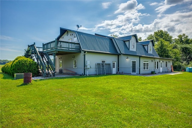 2098 2070th Ave, Saint Elmo, IL 62458 - back of property with a wooden deck, stairway, a metal roof, and a yard