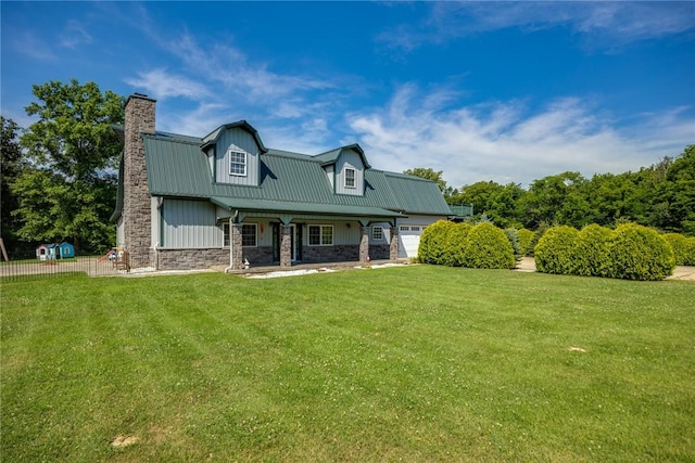 2098 2070th Ave, Saint Elmo, IL 62458 - view of front of house featuring a chimney, stone siding, covered porch, a metal roof, and board and batten siding
