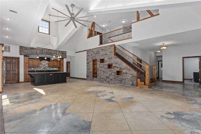 2098 2070th Ave, Saint Elmo, IL 62458 - unfurnished living room featuring high vaulted ceiling, a ceiling fan, and stairs