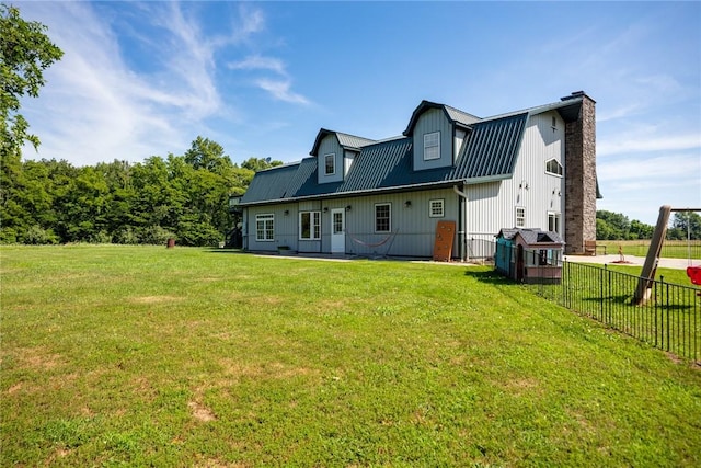 2098 2070th Ave, Saint Elmo, IL 62458 - back of house with a chimney, board and batten siding, and a metal roof