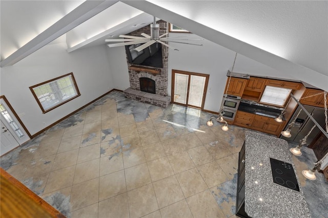 2098 2070th Ave, Saint Elmo, IL 62458 - unfurnished living room featuring ceiling fan, a fireplace with raised hearth, and high vaulted ceiling