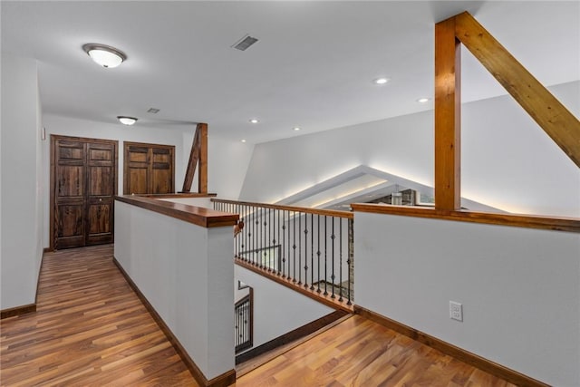2098 2070th Ave, Saint Elmo, IL 62458 - hallway featuring wood finished floors, lofted ceiling, recessed lighting, and an upstairs landing