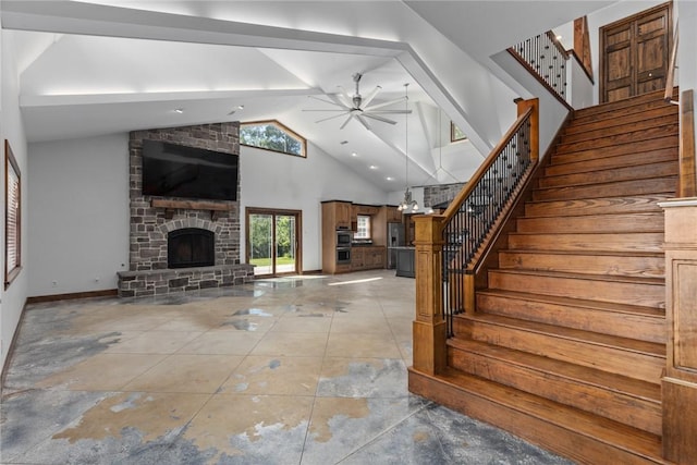 2098 2070th Ave, Saint Elmo, IL 62458 - staircase featuring ceiling fan, a stone fireplace, and high vaulted ceiling