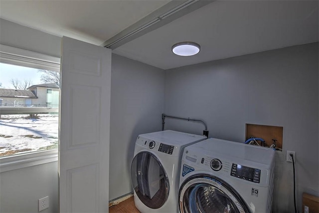 washroom featuring washing machine and dryer