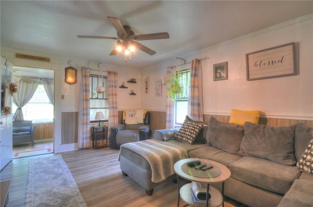 805 N 33rd St, Decatur, IL 62521 - living area with wainscoting, a ceiling fan, wood finished floors, and wood walls