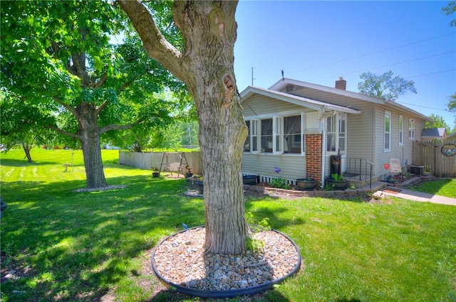 805 N 33rd St, Decatur, IL 62521 - view of front of house with a chimney and central AC unit