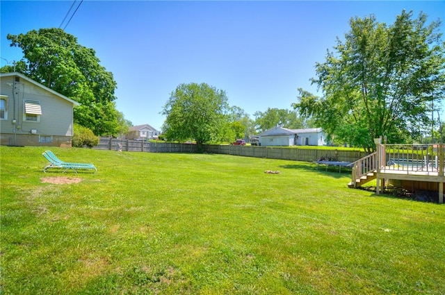 805 N 33rd St, Decatur, IL 62521 - view of yard featuring a trampoline and a wooden deck