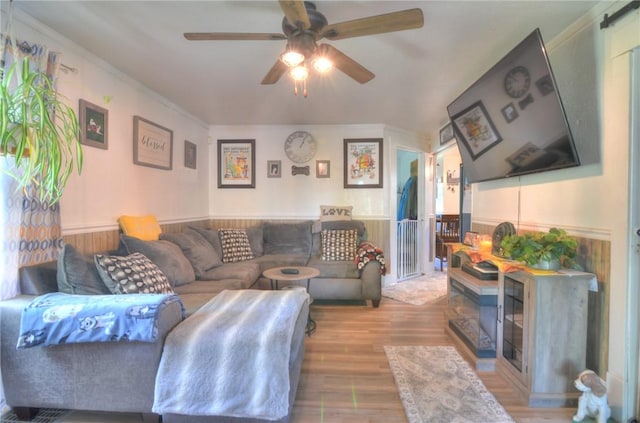 805 N 33rd St, Decatur, IL 62521 - living room featuring ceiling fan, wood finished floors, and wainscoting