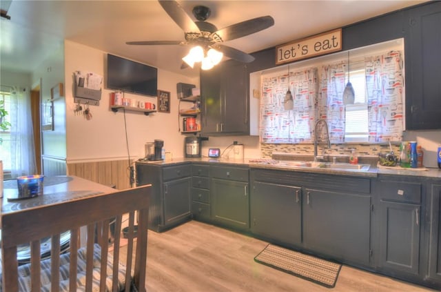 805 N 33rd St, Decatur, IL 62521 - kitchen featuring a sink, wainscoting, a ceiling fan, light wood finished floors, and open shelves