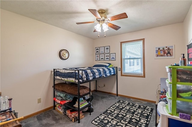 510 W Illinois St, Assumption, IL 62510 - carpeted bedroom with baseboards and a ceiling fan