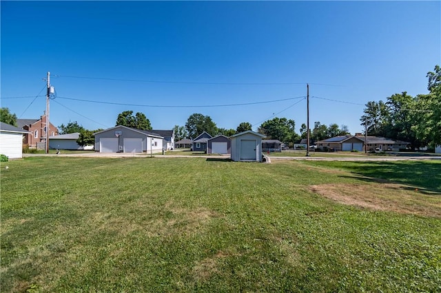510 W Illinois St, Assumption, IL 62510 - view of green lawn with a garage and an outbuilding