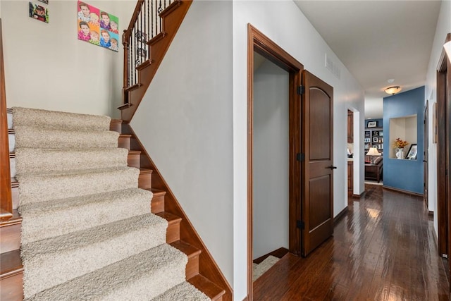 stairs featuring wood-type flooring