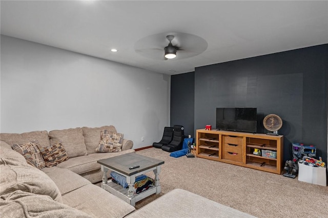 carpeted living room featuring ceiling fan