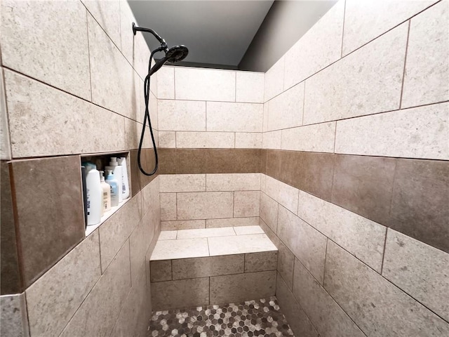full bathroom with a tile shower