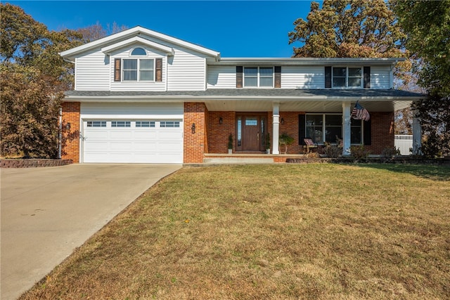 view of front property with covered porch, a garage, and a front yard