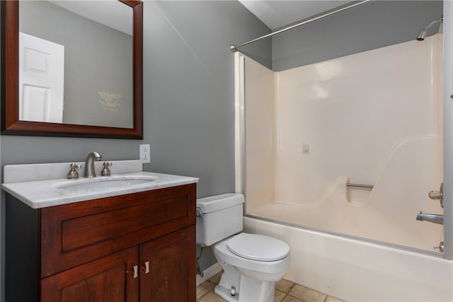 full bathroom featuring toilet, tile patterned floors, vanity, and bathing tub / shower combination