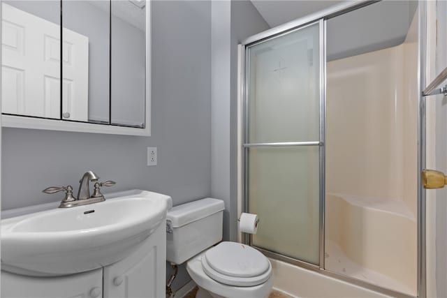 bathroom with sink, toilet, and walk in shower