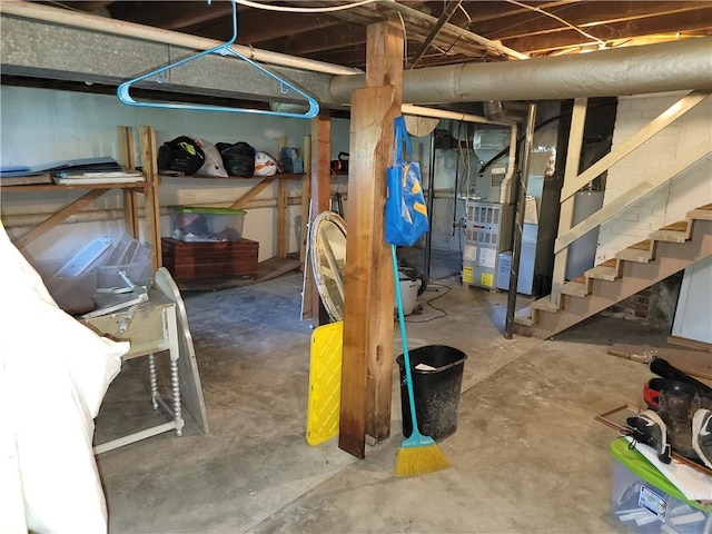 410 E Ninth St, Pana, IL 62557 - unfinished basement with stairs and heating unit