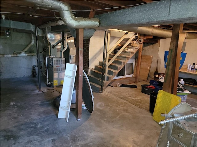 410 E Ninth St, Pana, IL 62557 - unfinished below grade area with stairs and heating unit