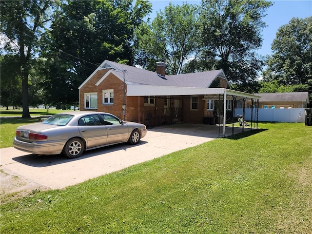410 E Ninth St, Pana, IL 62557 - view of property exterior featuring driveway, a carport, a chimney, and brick siding