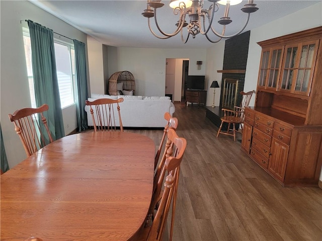 410 E Ninth St, Pana, IL 62557 - dining area with a chandelier and wood finished floors