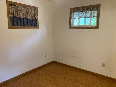 13859 Lake Jasper S Ave, Newton, IL 62448 - empty room featuring dark wood-style flooring