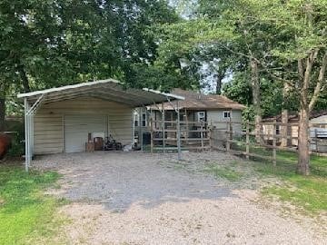 13859 Lake Jasper S Ave, Newton, IL 62448 - view of front of home with a garage, an outbuilding, and driveway