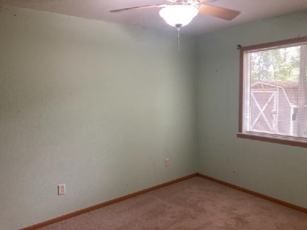13859 Lake Jasper S Ave, Newton, IL 62448 - spare room featuring a ceiling fan and light carpet
