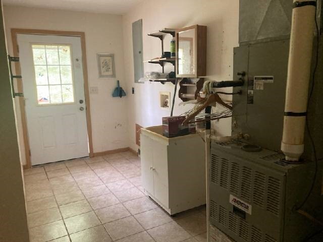 13859 Lake Jasper S Ave, Newton, IL 62448 - entrance foyer with light tile patterned floors, electric panel, and heating unit
