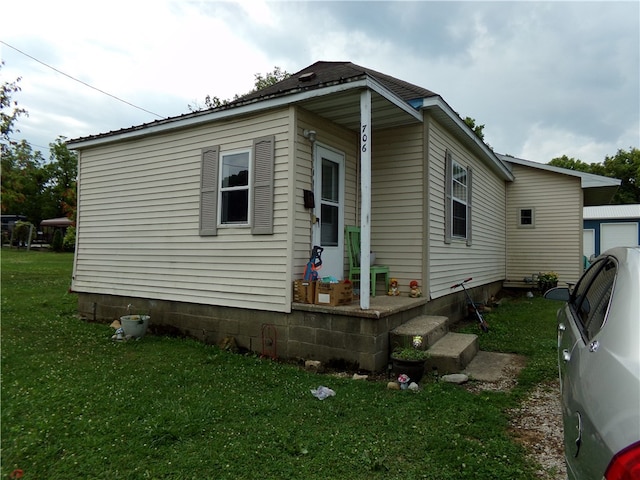 view of home's exterior featuring a yard