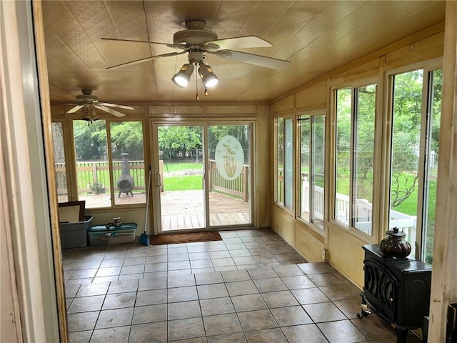 8 Noyes Ct, Mattoon, IL 61938 - sunroom / solarium with lofted ceiling, tile patterned floors, and a wood stove