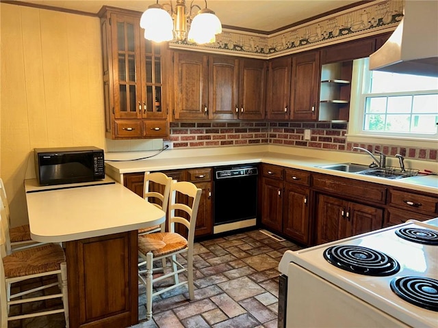 8 Noyes Ct, Mattoon, IL 61938 - kitchen featuring black appliances, exhaust hood, brick patterned flooring, a kitchen breakfast bar, and light countertops
